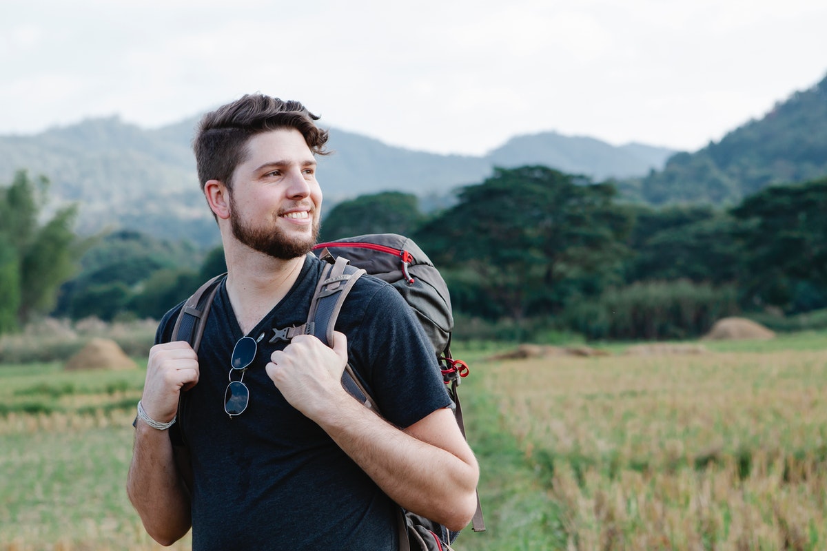 man solo travelling backpacking