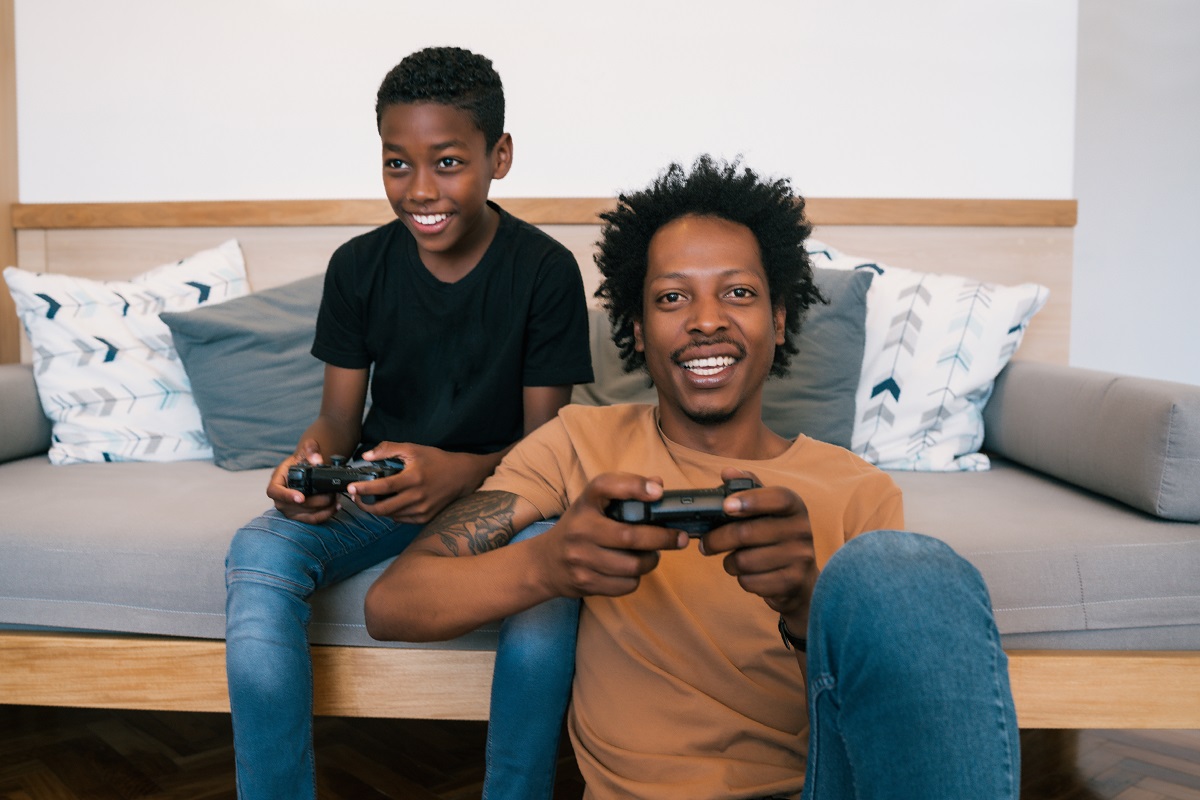 happy dad and son playing games 