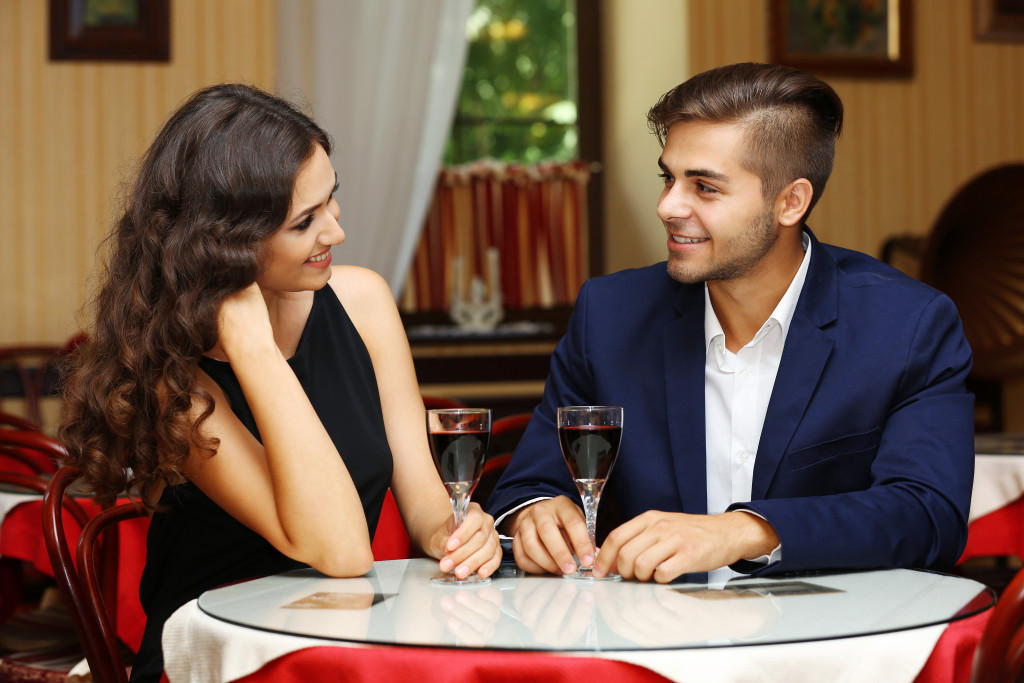 Young couple on a date at a restaurant.