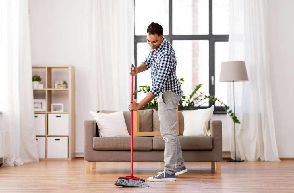 man cleaning the home